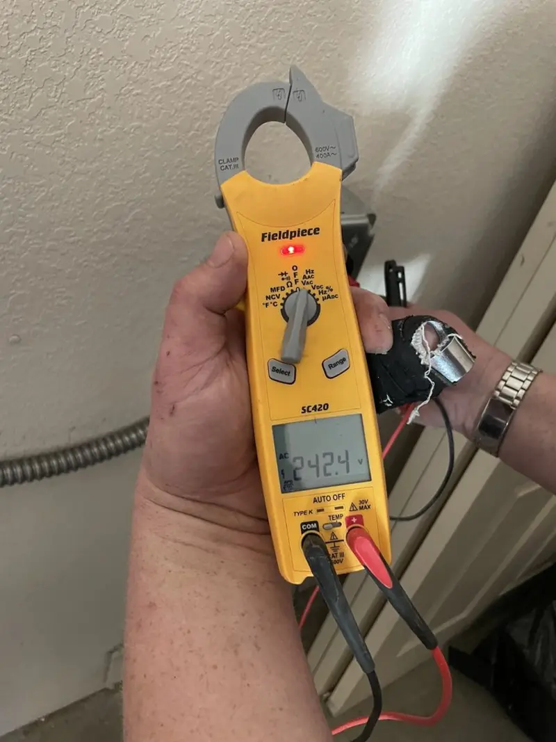 Voltage testing with clamp meter during Generator Installation in Temple Terrace